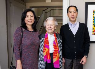 couple stands with mentor