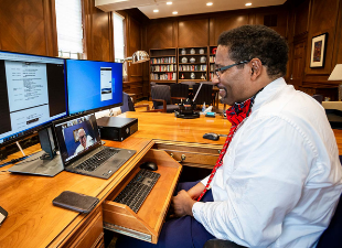 Dr. Pines at computer desk