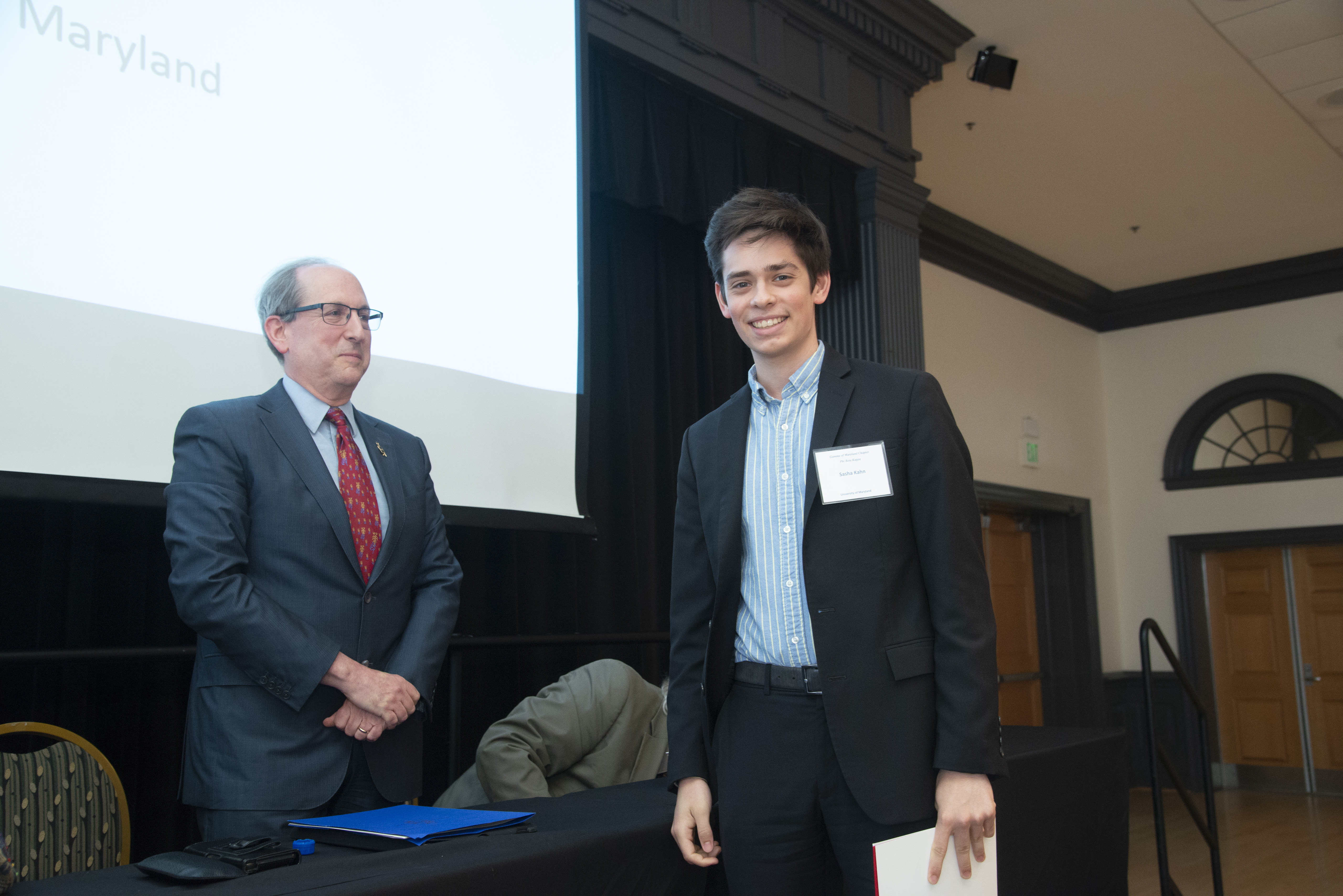 A recently inducted member of PBK crosses the stage